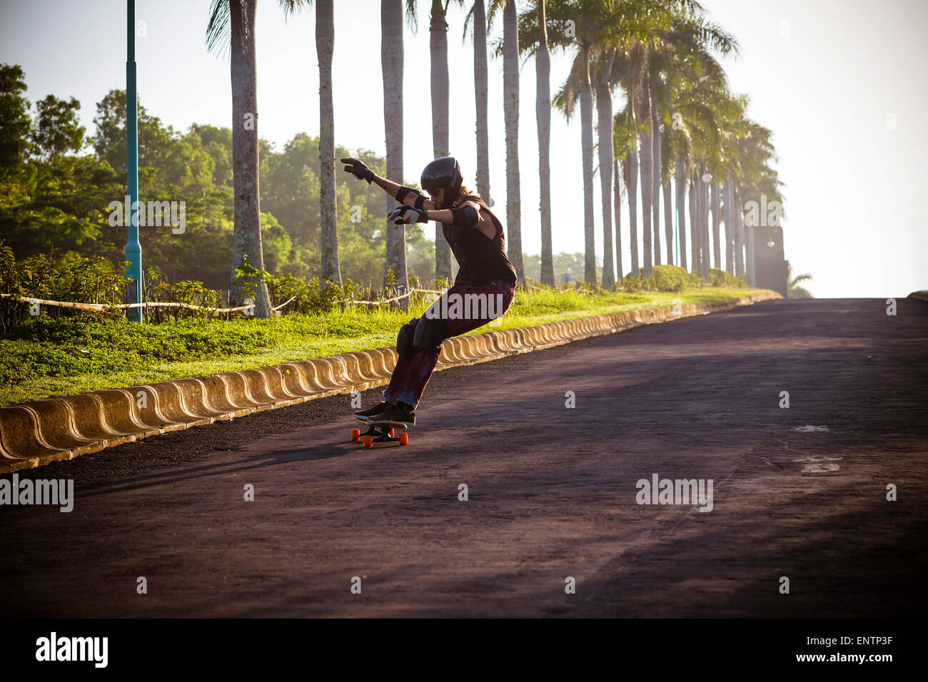 Man riding on a longboard skate, Bali, Indonesia. Stock Photo