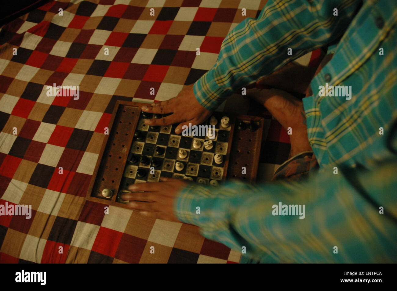 A blind Shahidul Islam is playing chess. He is studying at Dhaka