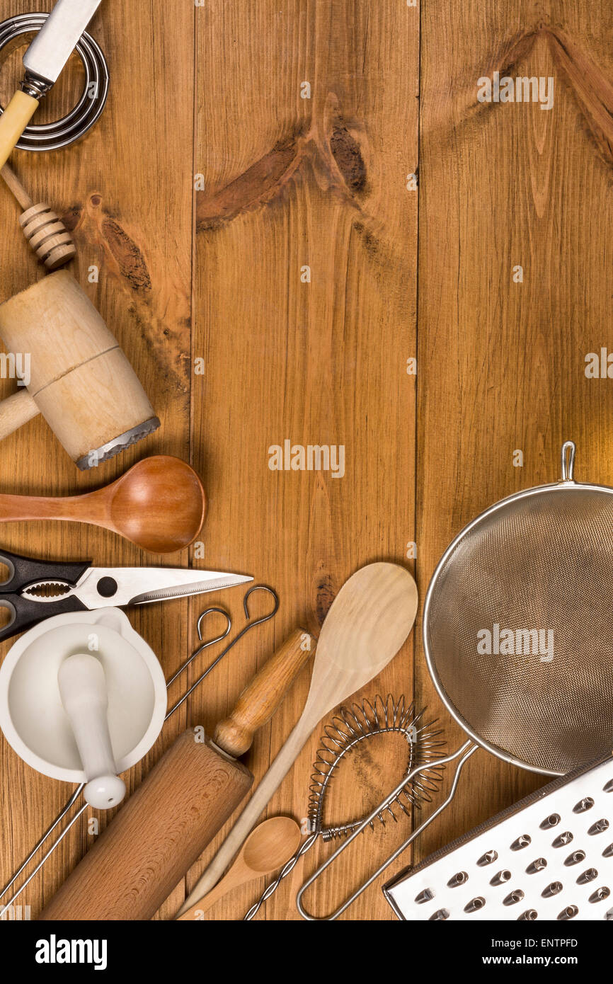 A selection of Kitchen Utensils on a farmhouse kitchen table - with Space for Text Stock Photo