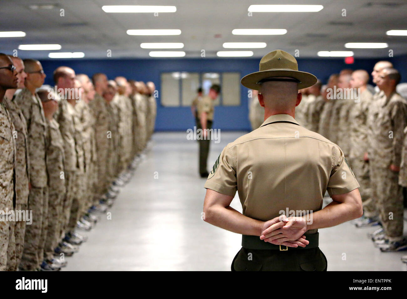 A US Marine Corps drill instructor yells at new recruits during training October 26, 2013 on Parris Island, S.C.  This was the first time the recruits met the Marine Corps drill instructors who would train them for the next 12 weeks. Stock Photo