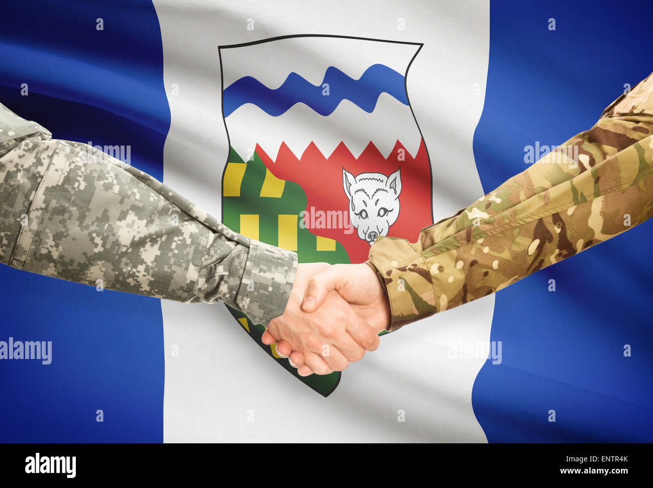 Soldiers handshake and Canadian province flag Northwest Territories