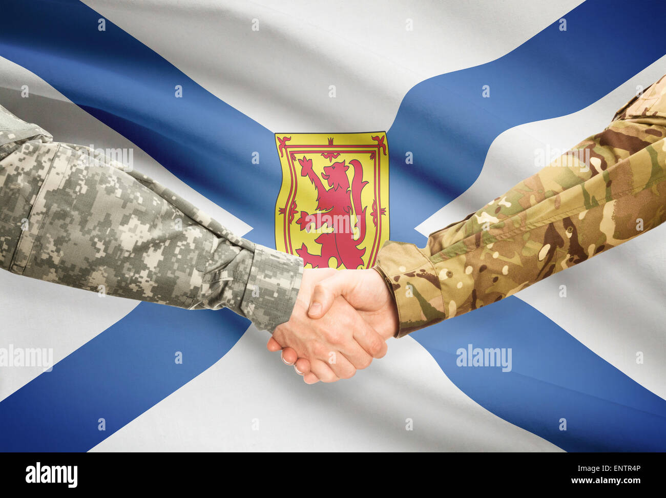 Soldiers handshake and Canadian province flag Nova Scotia Stock Photo