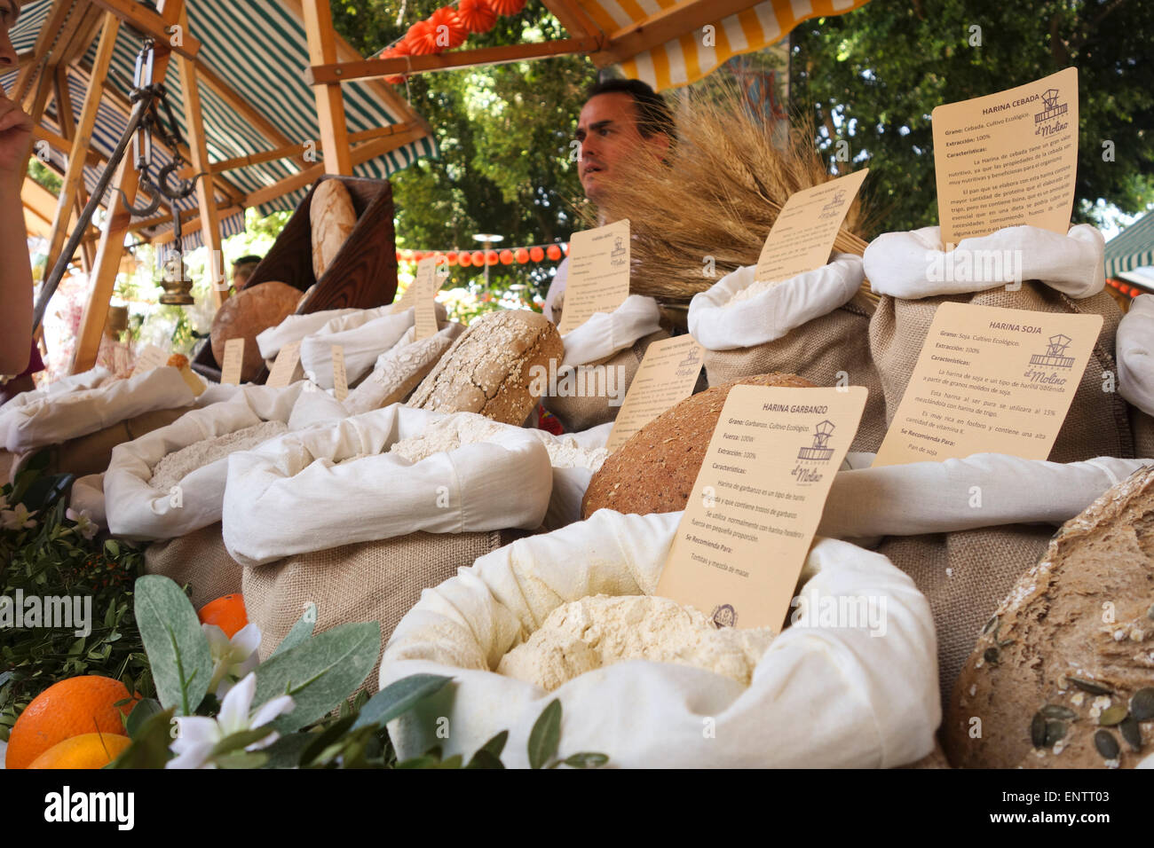Different flour for bread, grinded by local mill on display at outdoor market. Andalusia, Spain. Stock Photo
