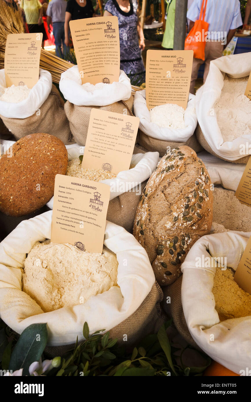 Different flour for bread, grinded by local mill on display at outdoor market. Andalusia, Spain. Stock Photo