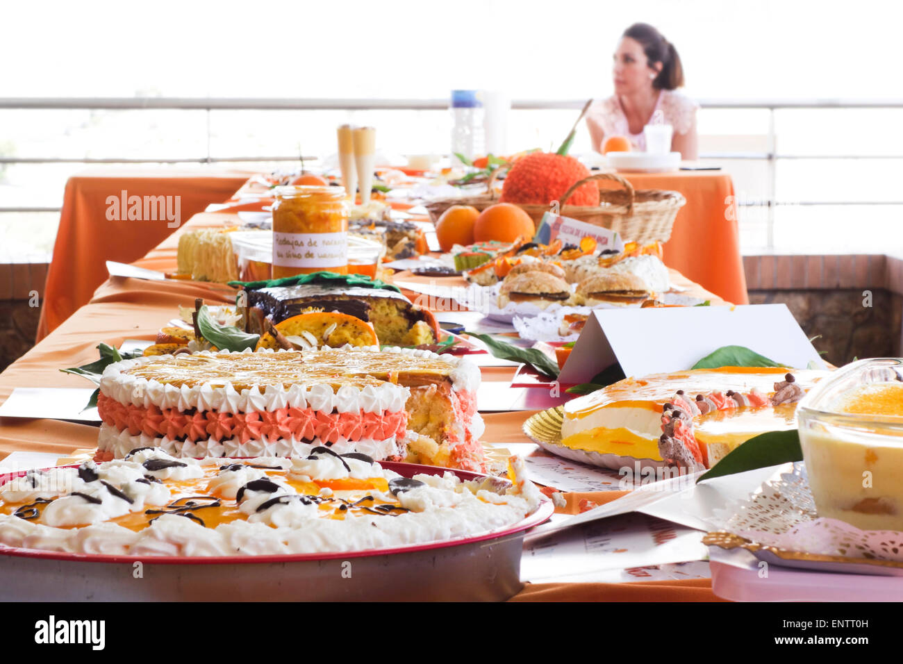 Table with different orange desserts on display, Annual Orange Festival Celebration in Coin, Andalusia, Spain. Stock Photo