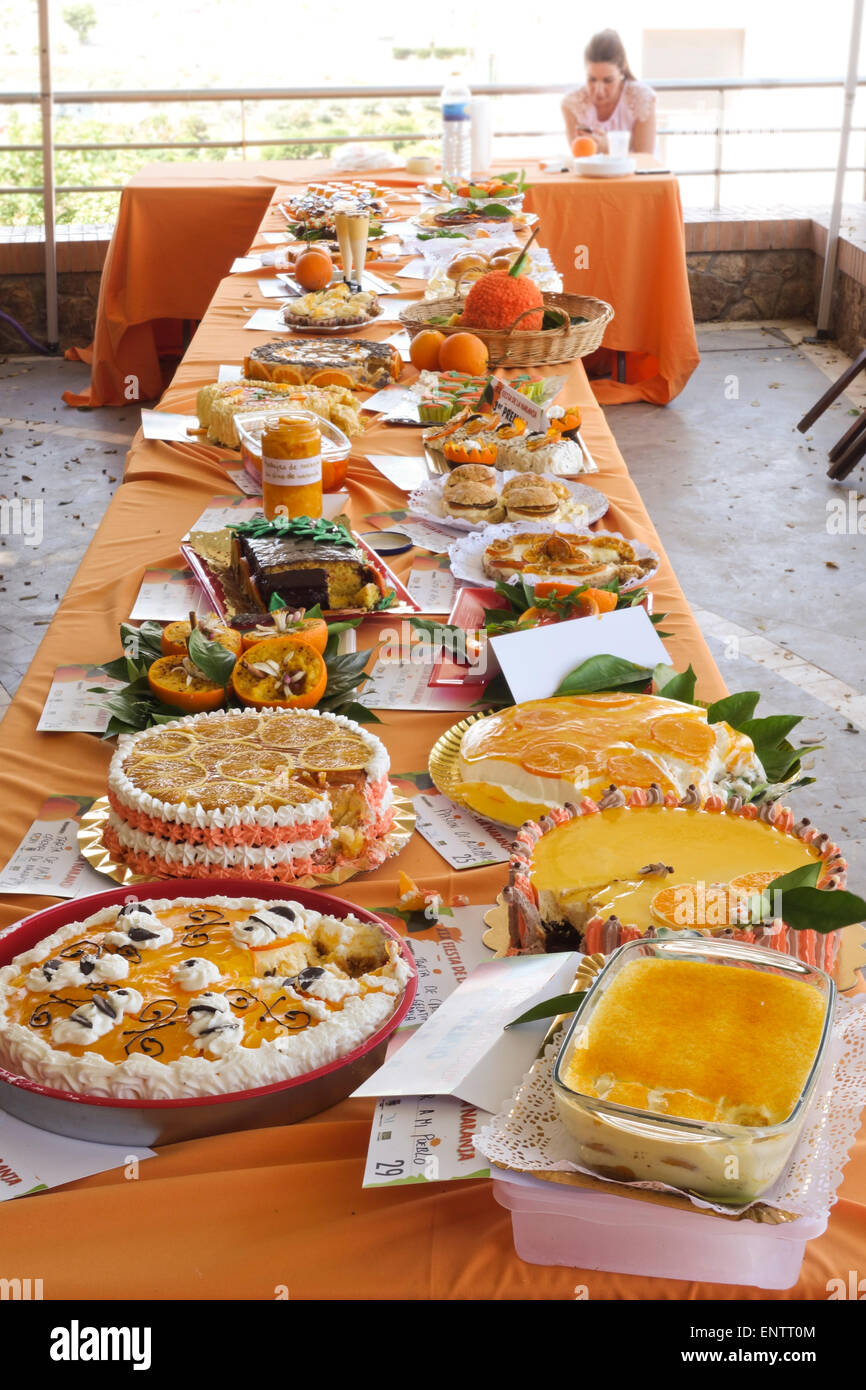 Table with different orange desserts on display, Annual Orange Festival Celebration in Coin, Andalusia, Spain. Stock Photo
