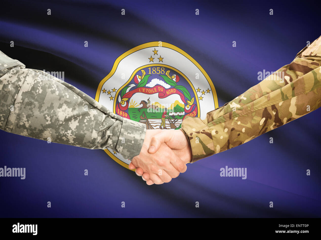 Soldiers handshake and US state flag - Minnesota Stock Photo