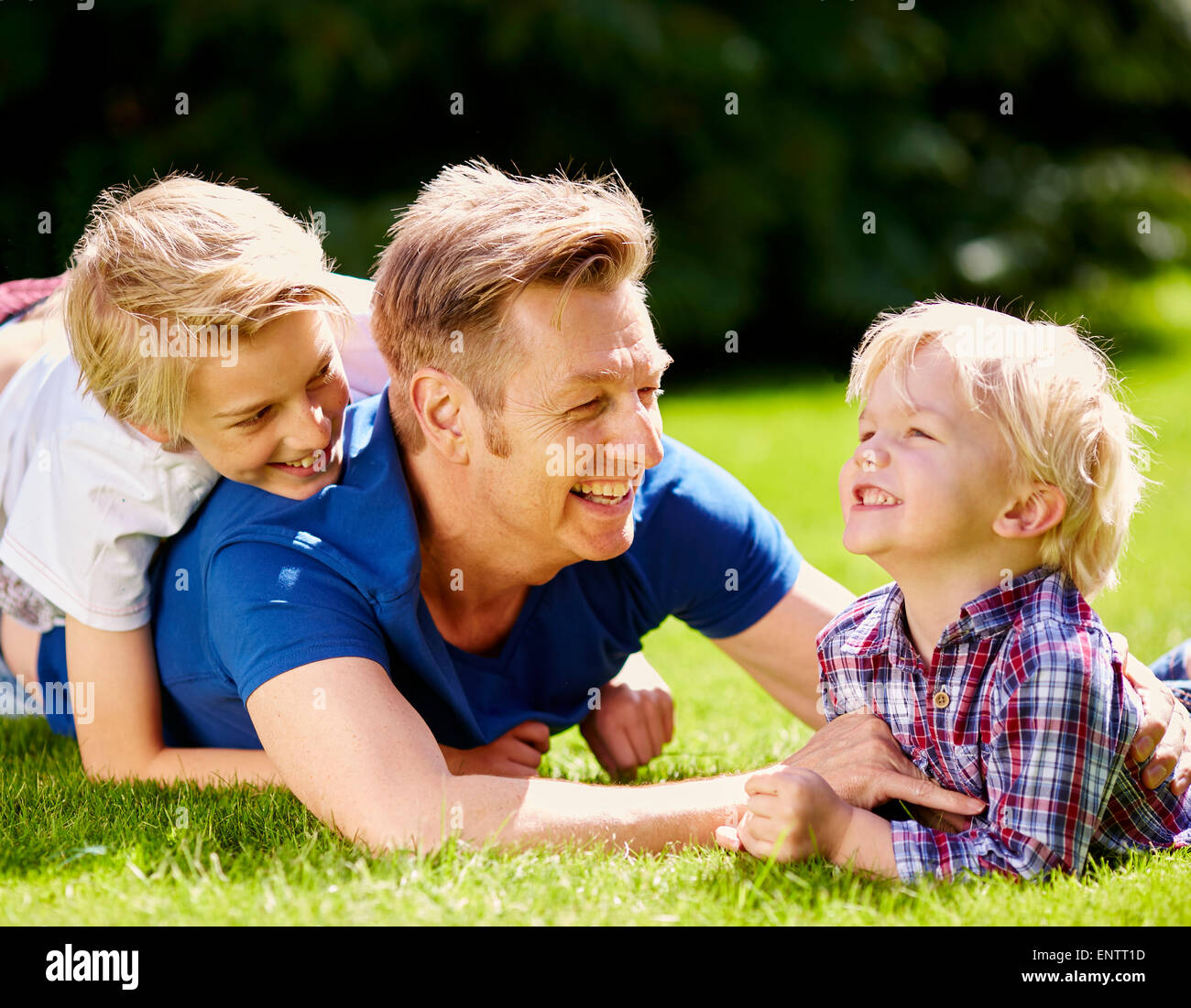 Father playing with is children outdoors Stock Photo