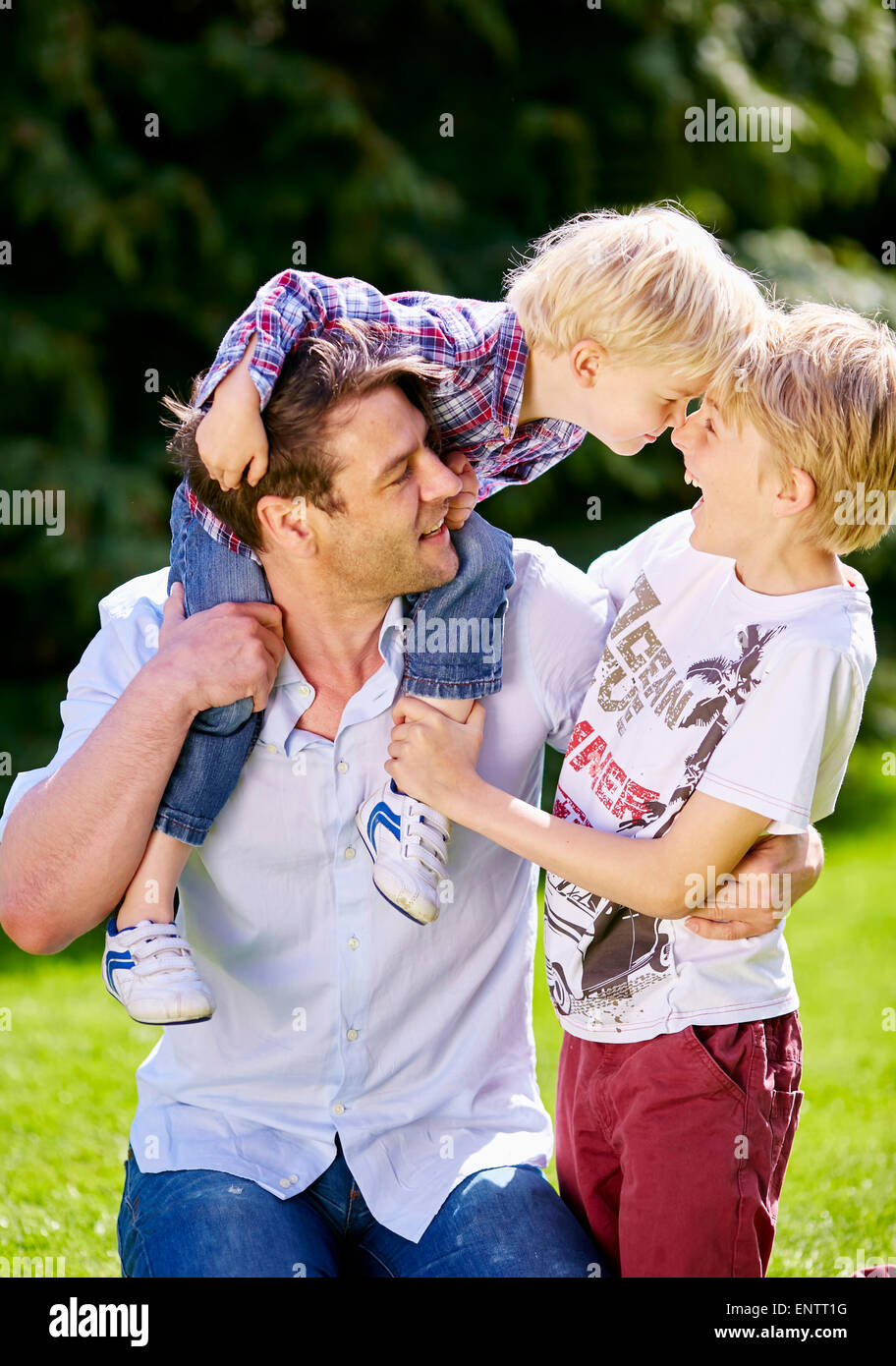 Father playing with is children outdoors Stock Photo