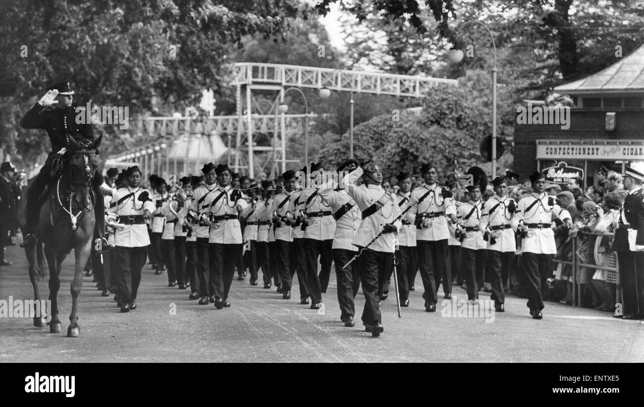 As curtain raiser for the Royal Tournament which opens at Earls Court 1,000 officers and men form British and Commonwealth forces taking part in the tournament paraded in Battersea Park . Led by the colourful band of the Fiji Military Forces the men taking part in the tournament included The Royal Navel Field Gun Crew sailors and Marines from the 'Blockade and Raid' display gun teams of the Royal Horse Artillery's Musical Drive team of Army gymnasts and the Gontinuity Drill Squad of the Queen’s is Color Squadron R.A.F. and the RAF police dogs. The ladies were represented by the W.R.A.F. Band. Stock Photo