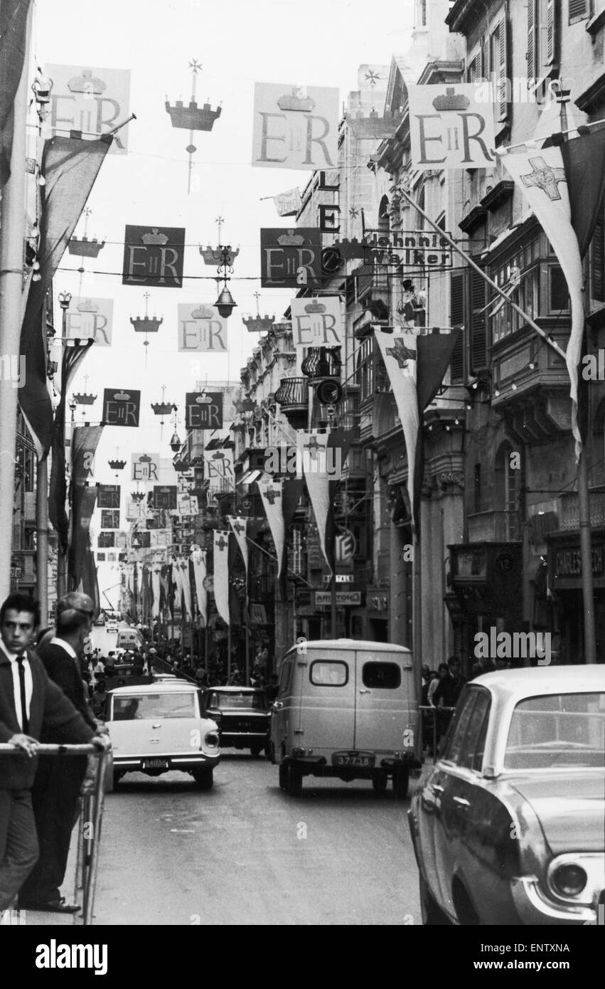 The streets of Valletta in Malta are decorated with bunting and flags to welcome The Queen and The Duke of Edinburgh. 15th November 1967. Stock Photo