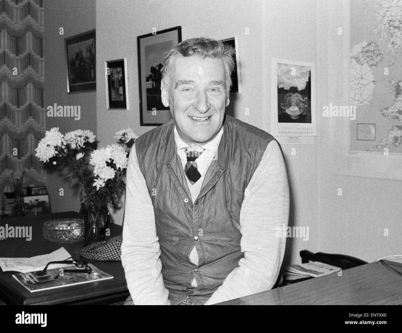 Donald 'Ginger' McCain, the trainer of famous champion racehorse Red Rum, pictured in his office at his stables in Southport, Merseyside ahead of the 1980 Grand national race. 26th March 1980. Stock Photo