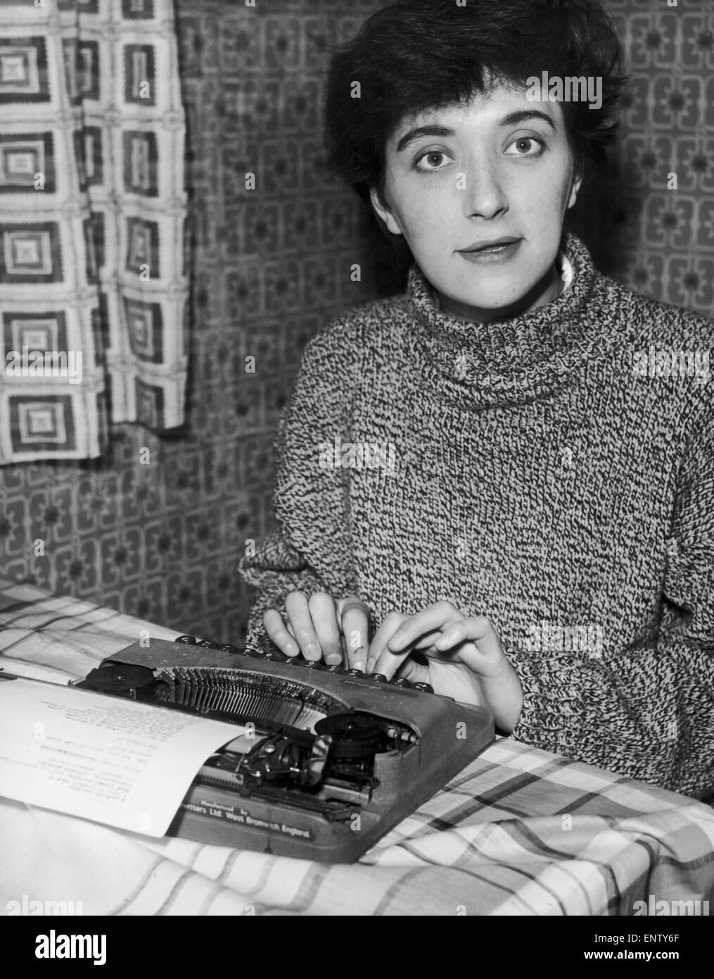 Salford born playwright Shelagh Delaney pictured at work on her typewriter at her home in Duchy Road, Salford ahead of the premiere of her play 'A Taste of Honey' which is to open at a West End theatre in February. 1st January 1959. Stock Photo