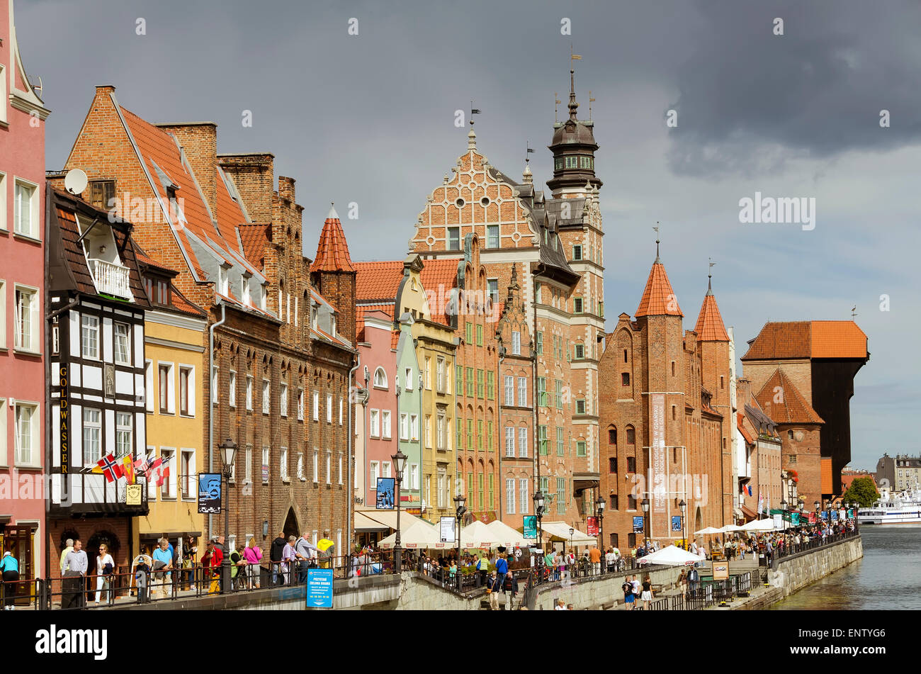 Scenic View Old Town Gdansk Poland beside the Motlawa River tourists stroll promenade. Stock Photo