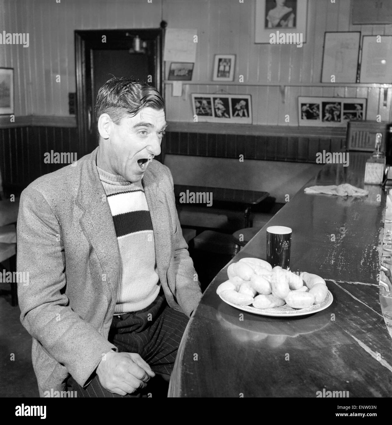 Sausage eating champion: Joe Steele of Bedlington Northumberland champion raw sausage eating champion. Circa 1965. Stock Photo