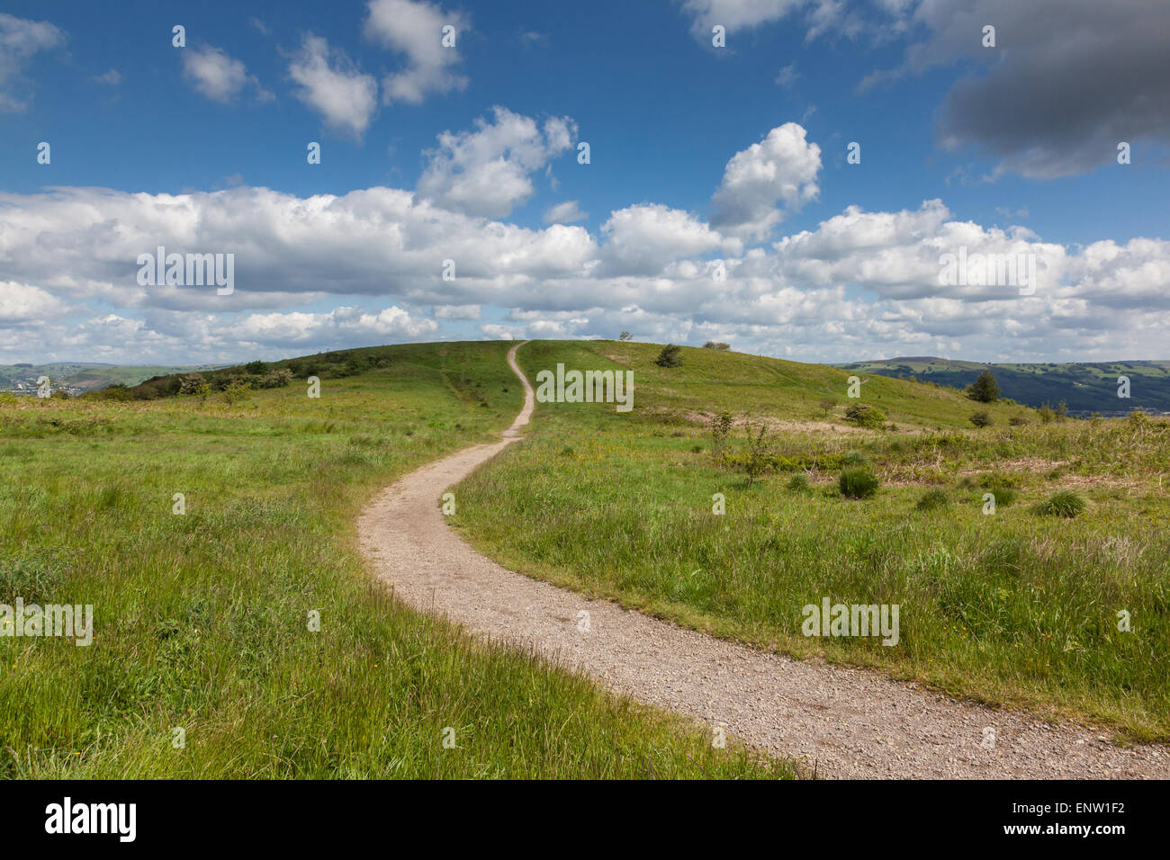 A winding path wends its way up Caerphilly mountain, dissapears over the top, Caerphilly, Wales, UK Stock Photo