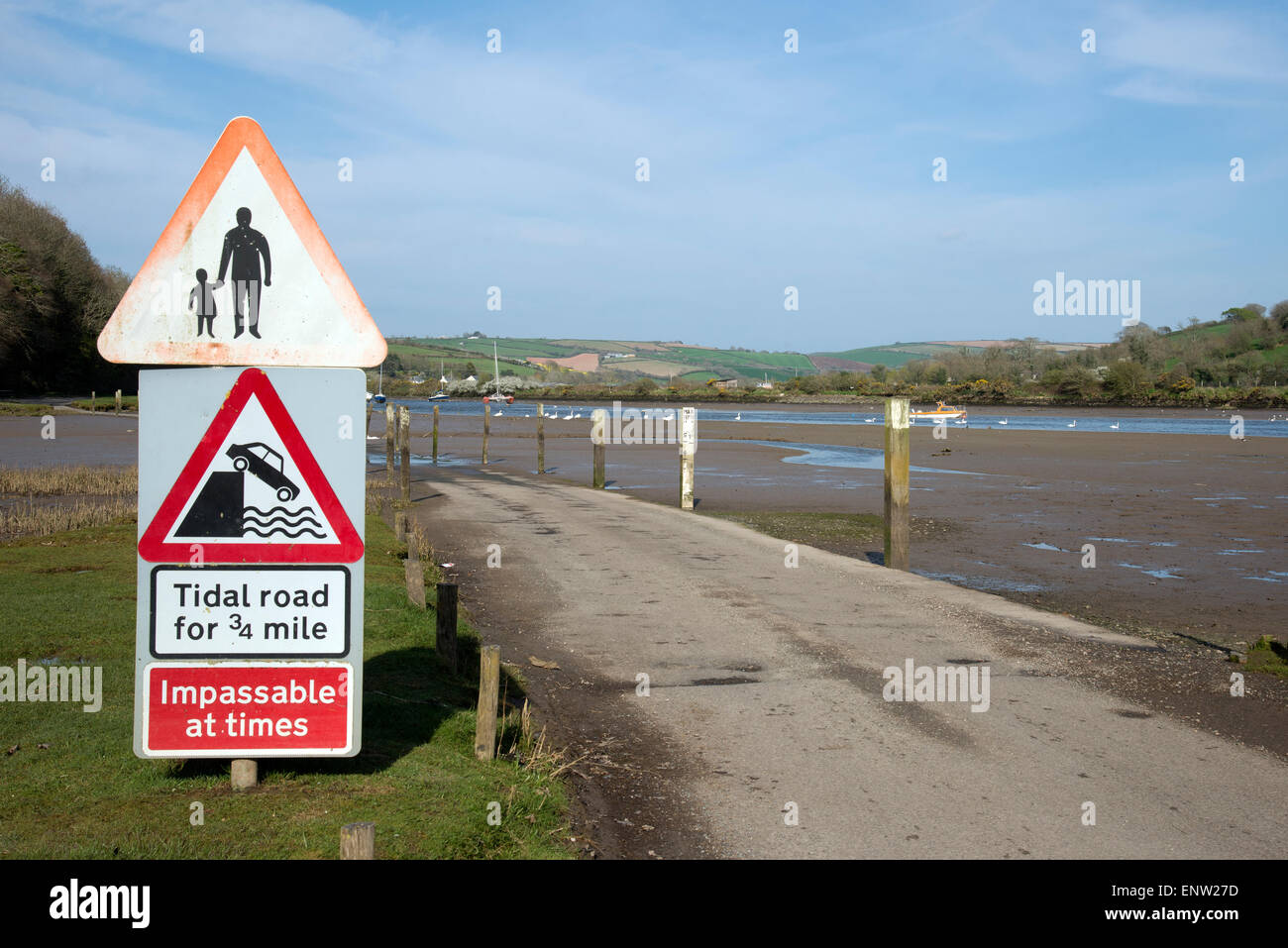 Tidal road warning notices at Aveton Gifford Devon England UK The road