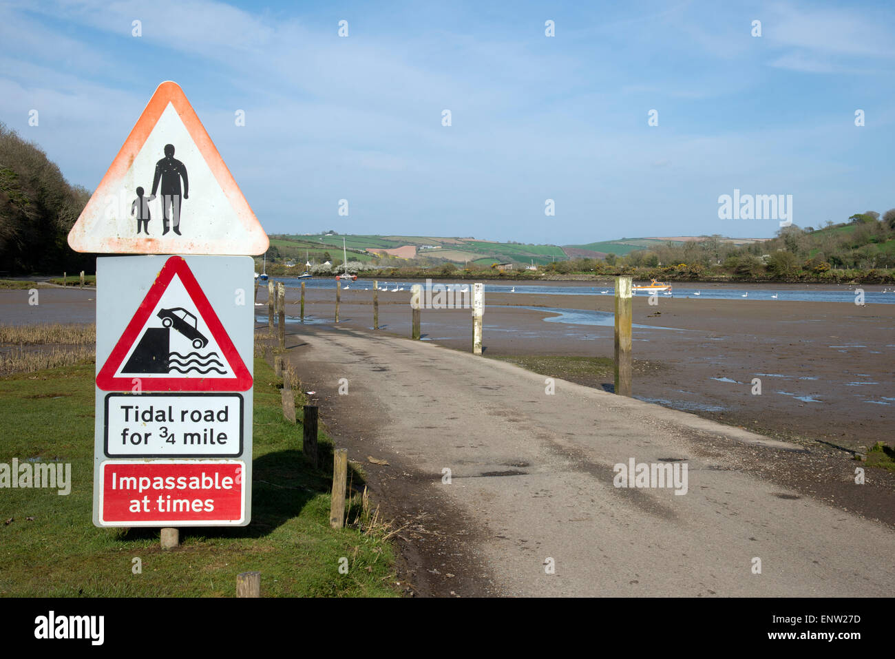 Tidal road warning notices at Aveton Gifford Devon England UK  The road floods with every high tide, twice a day Stock Photo
