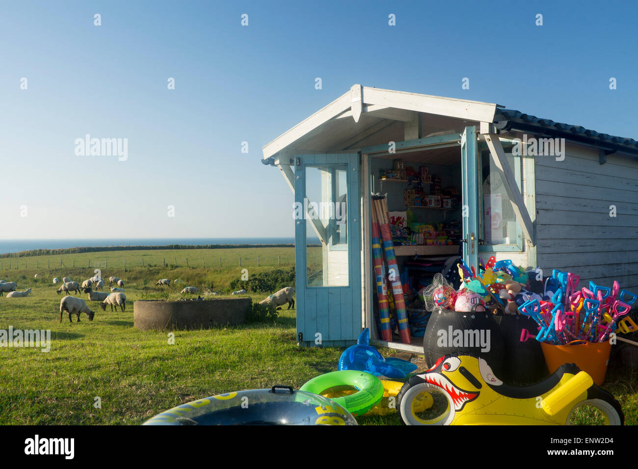 Porth Towyn Beach hut shack shop with beach toys, buckets and spades and buoyancy aids for sale Honesty shop on farm with sheep Stock Photo