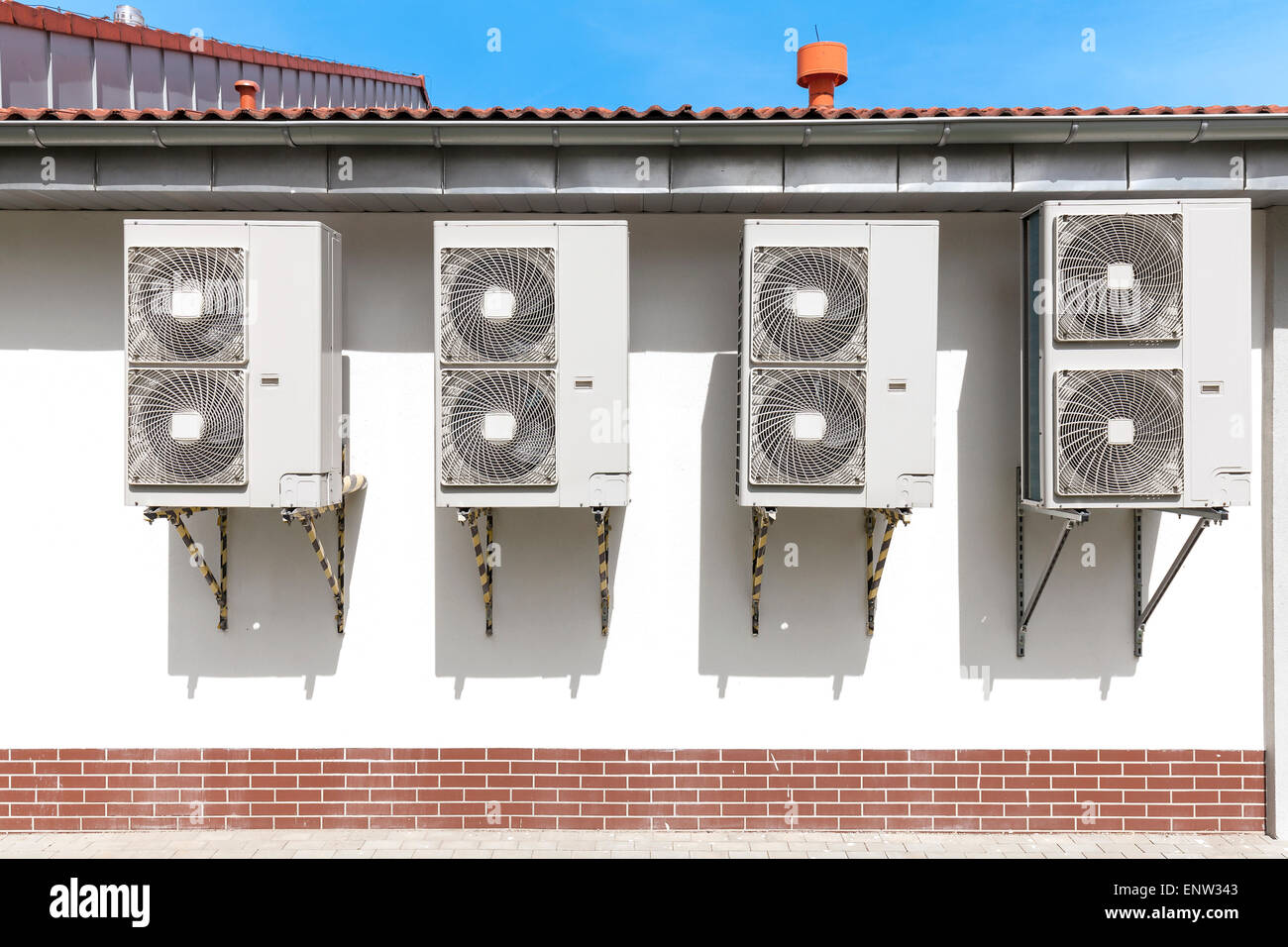 Air conditioning system assembled on a wall of a building. Stock Photo