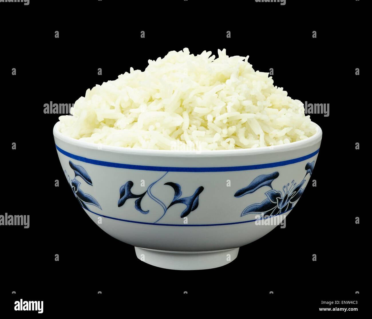 Natural organic rice in Asian bowl isolated on black background Stock Photo