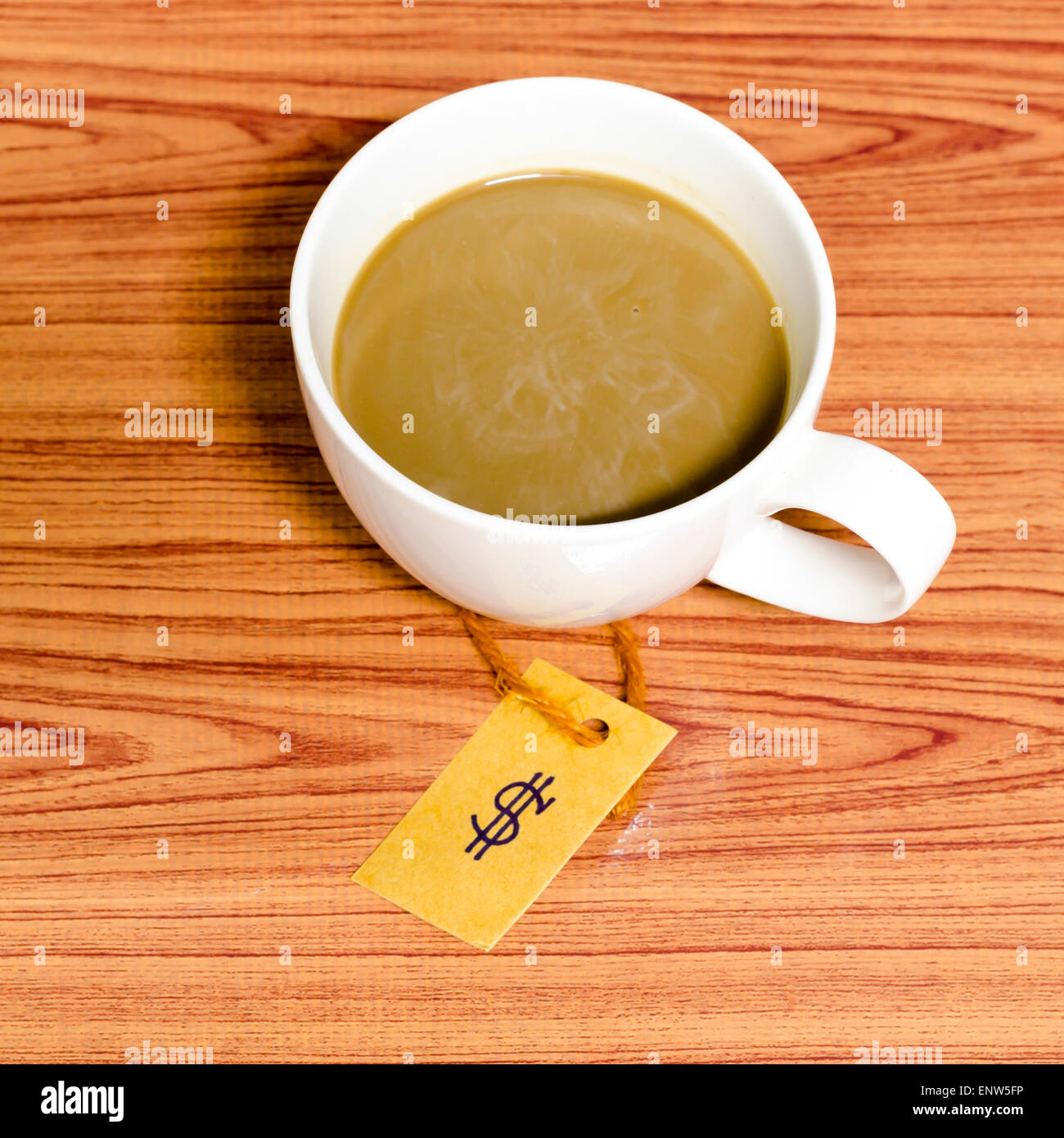 coffee cup with price tag on wood background Stock Photo
