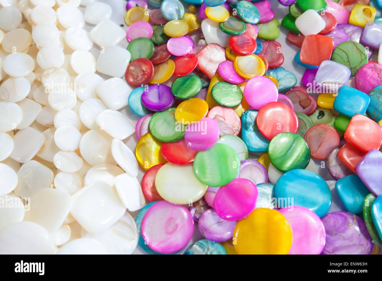 Beads of round colorful stones lie on the counter of souvenir shop on the beach in Dominican republic Stock Photo