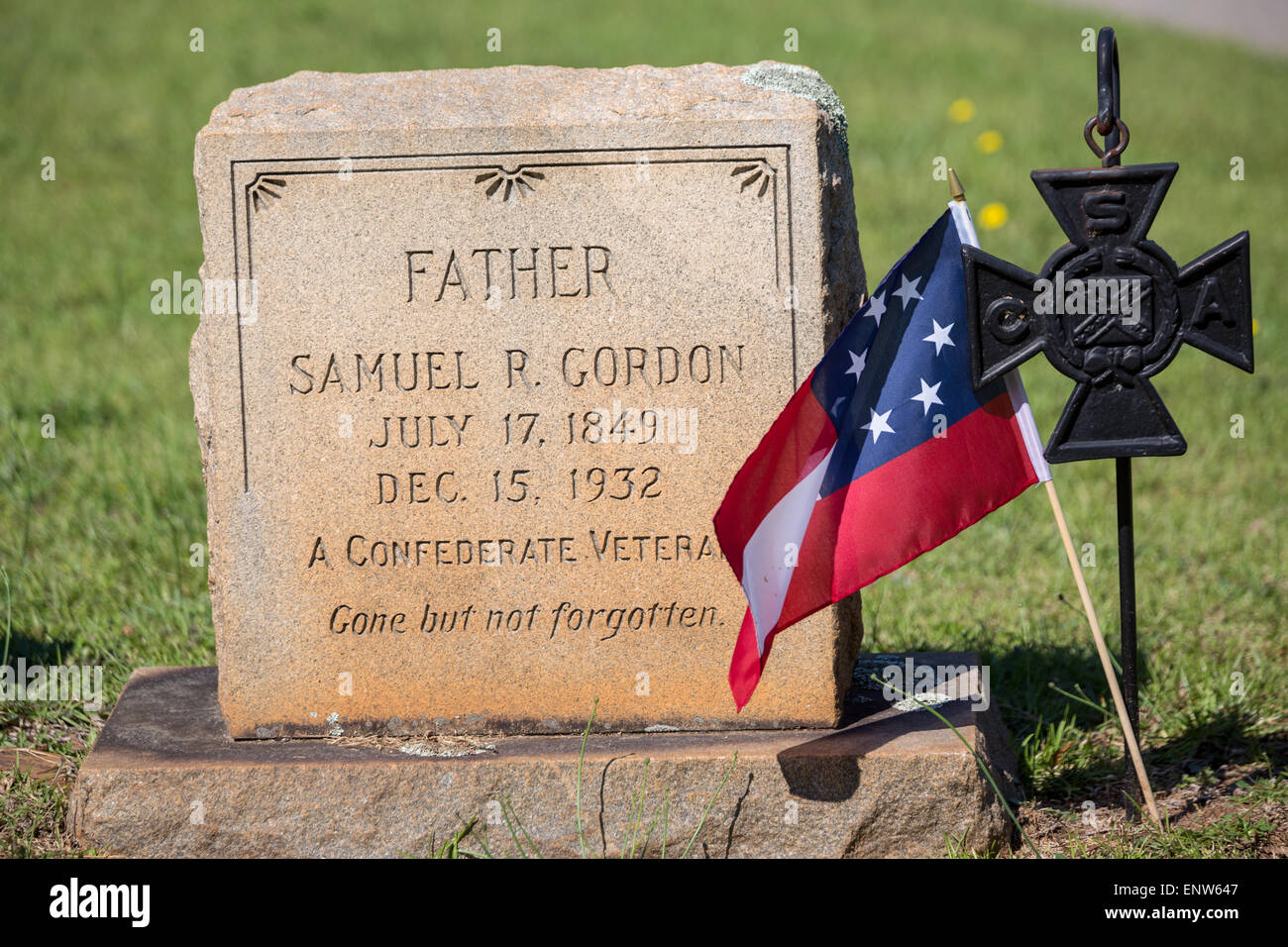 The grave marker of a civil war confederate veteran at Elmwood Cemetery decorated with a flag on Confederate Memorial Day May 2, 2015 in Columbia, SC. Confederate Memorial Day is an official state holiday in South Carolina and honors those that served during the Civil War. Stock Photo