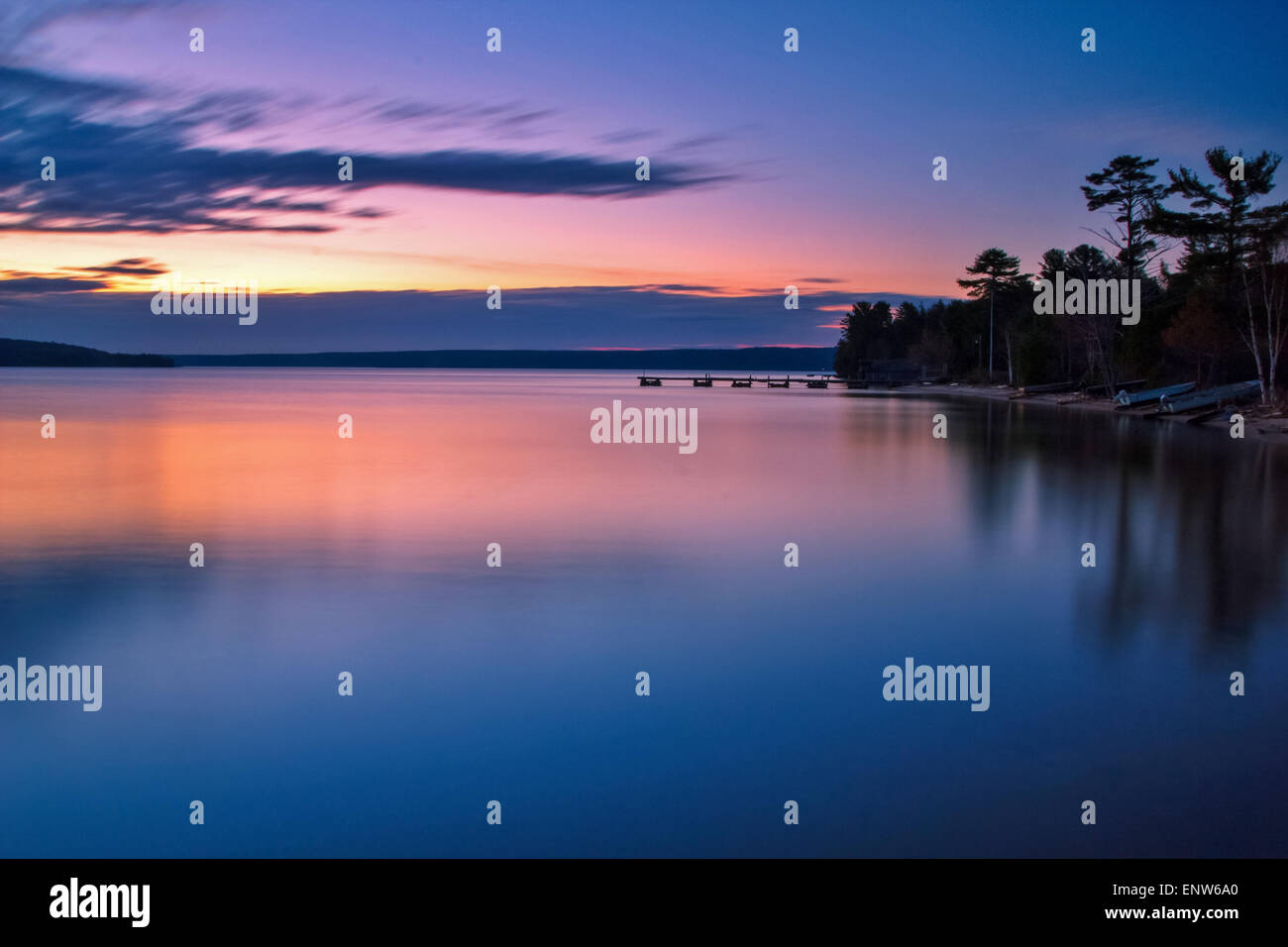 Lake Superior Sunrise. Sunrise reflections along the shores of a calm Lake Superior. Stock Photo