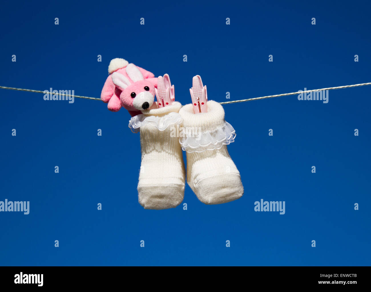 baby shoes in blue sky Stock Photo Alamy