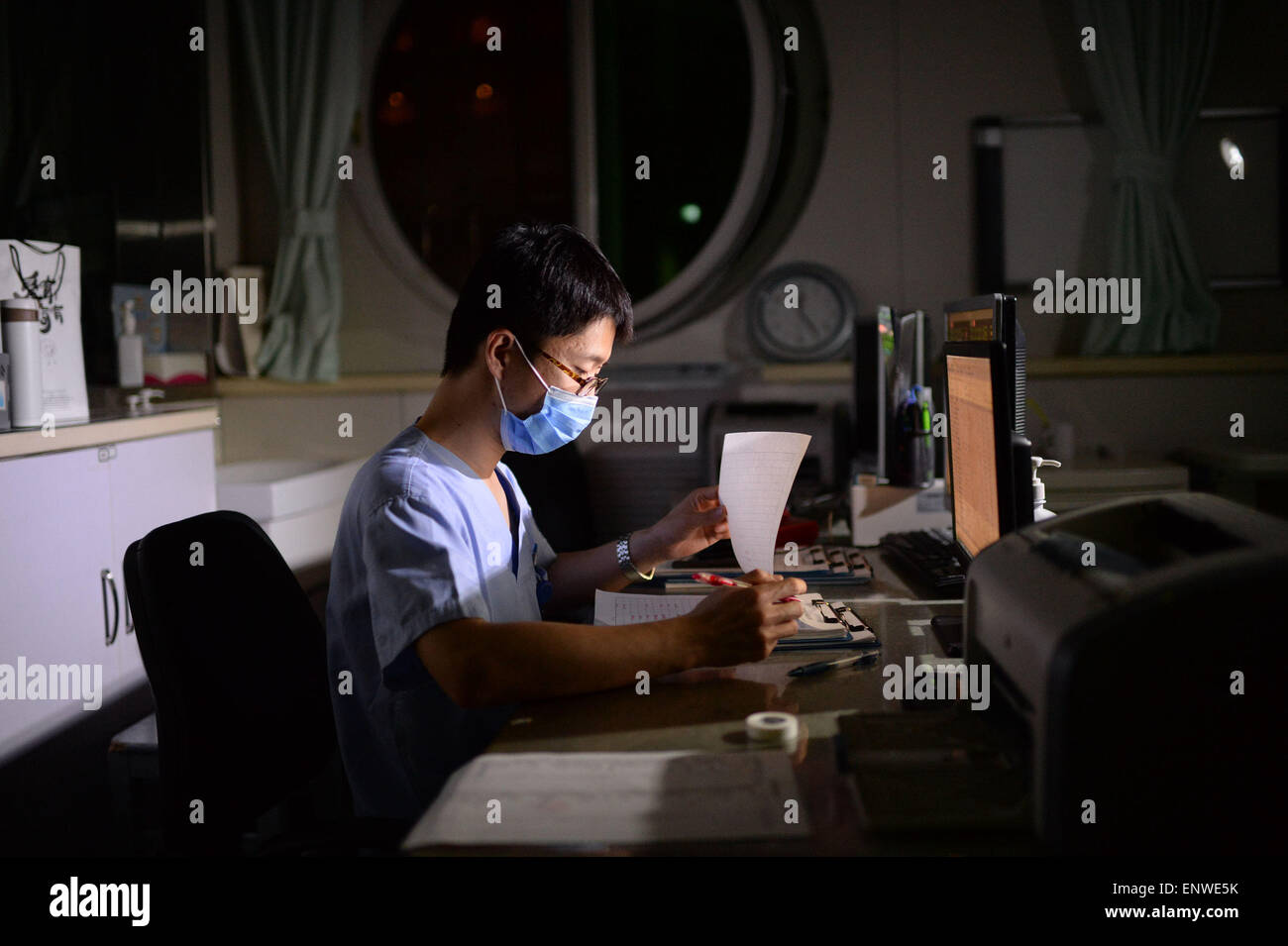 Beijing, China. 7th May, 2015. Nurse Dong Sixin works at the EICU in Beijing Air Force General Hospital in Beijing, capital of China, May 7, 2015. China had nearly 2.5 million registered nurses at the end of 2012, but males account for less than one percent of that number, according to official statistics. © Yu Hongchun/Xinhua/Alamy Live News Stock Photo