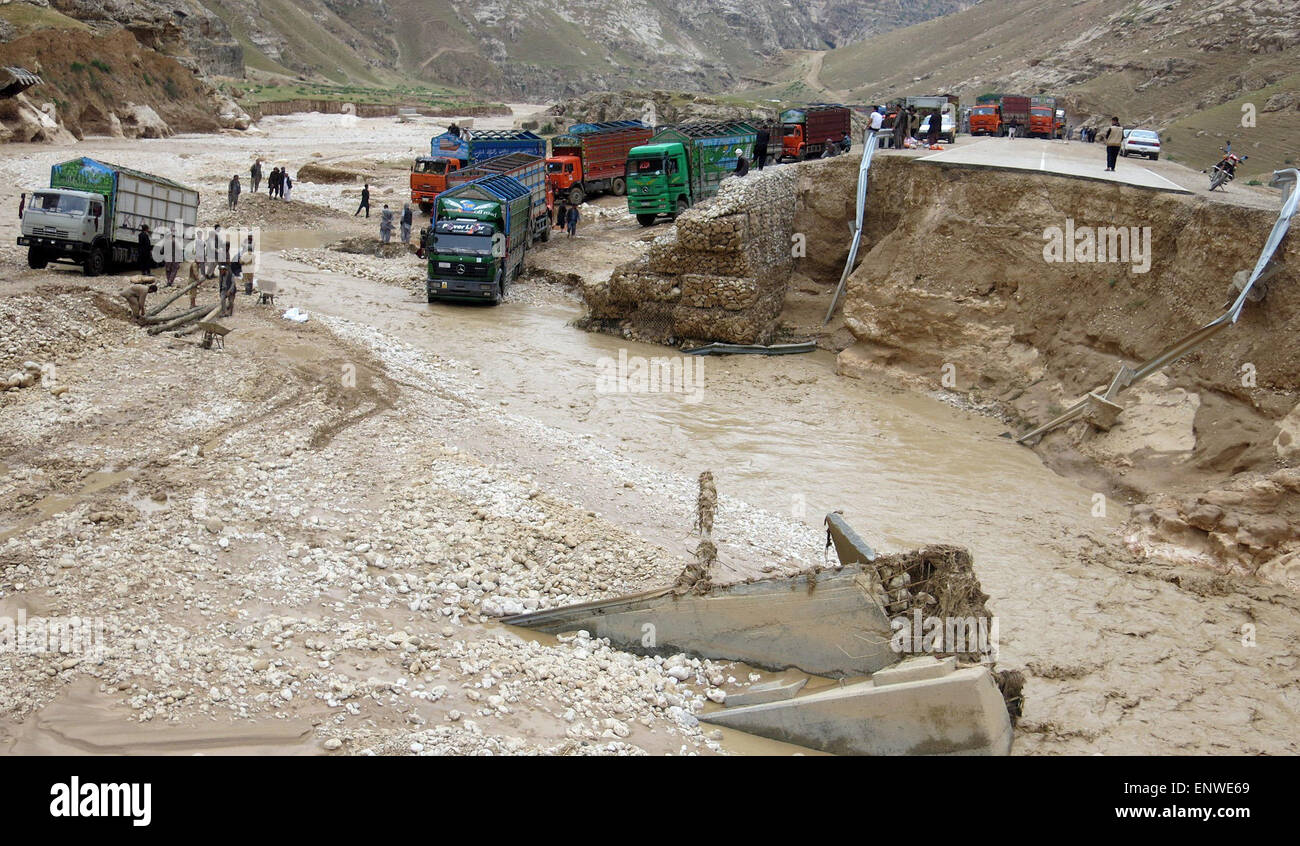 Samangan, Afghanistan. 12th May, 2015. Trucks wade across the flooded area after a heavy rain in Samanagan province, northern Afghanistan, May 12, 2015. Credit:  Azorda/Xinhua/Alamy Live News Stock Photo