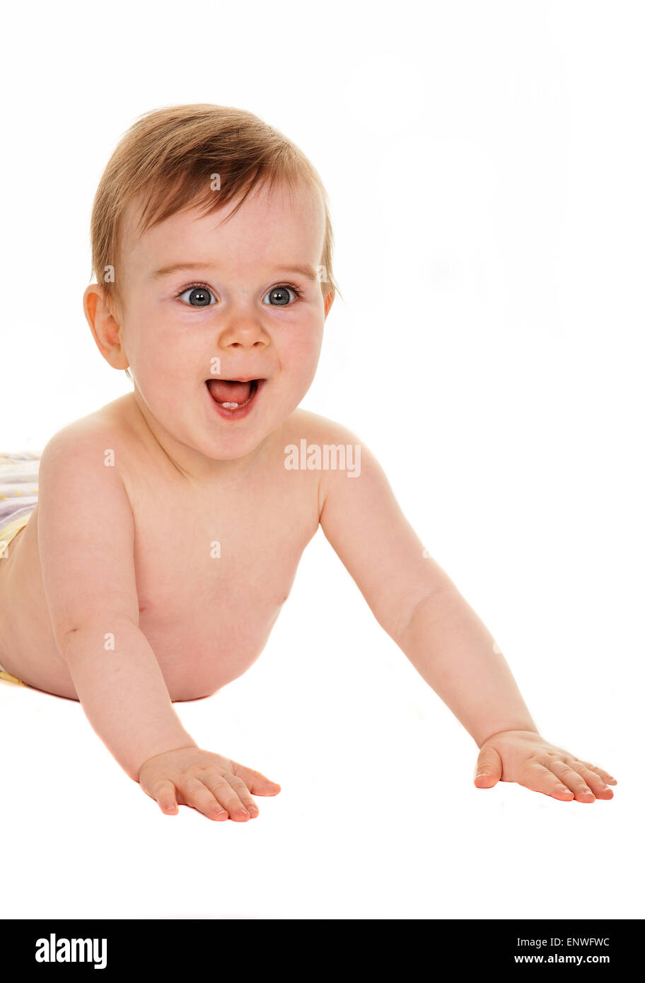 Toddler baby in swaddling clothes lying on the ground Stock Photo Alamy