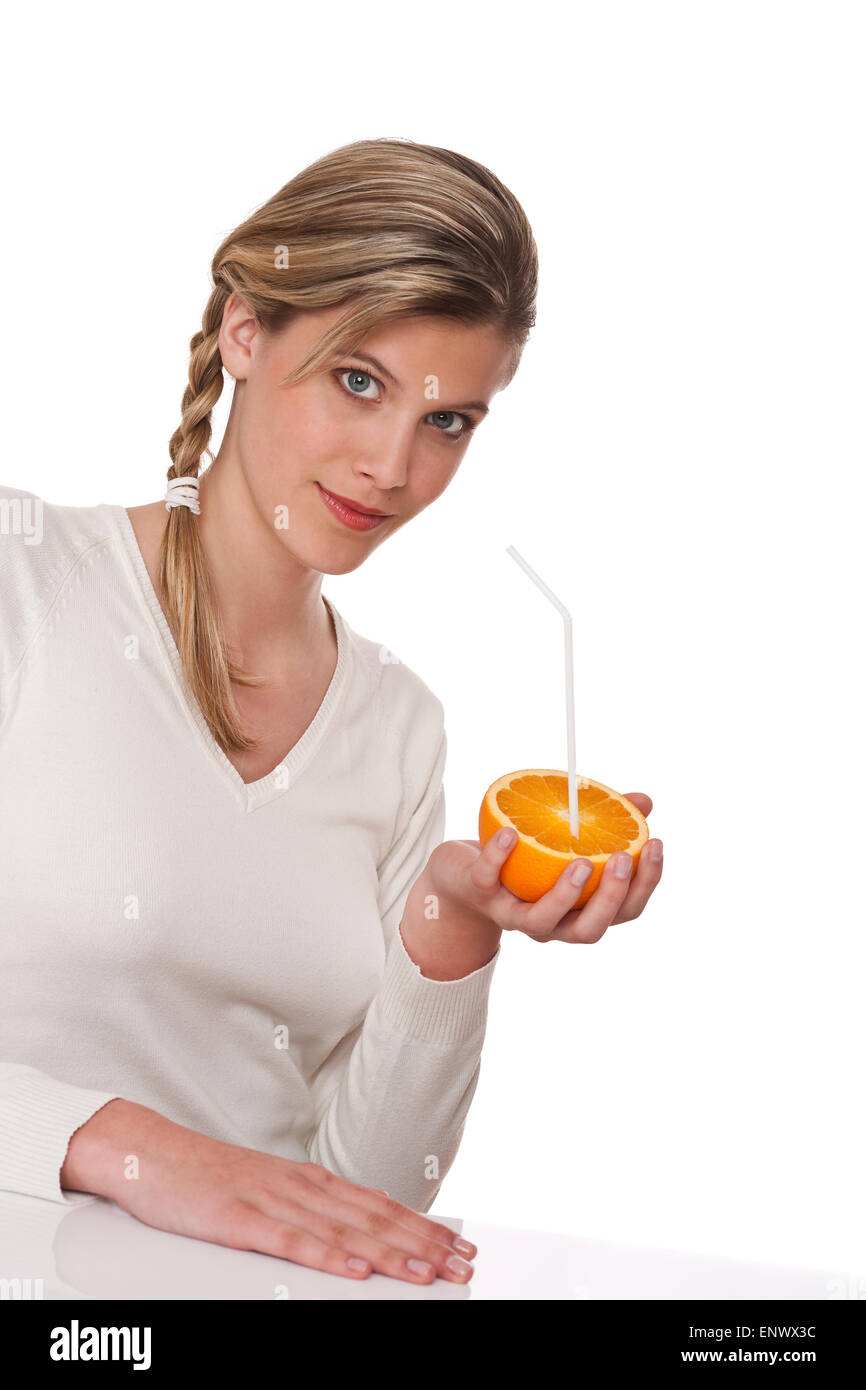 Healthy lifestyle series - Woman holding orange Stock Photo - Alamy