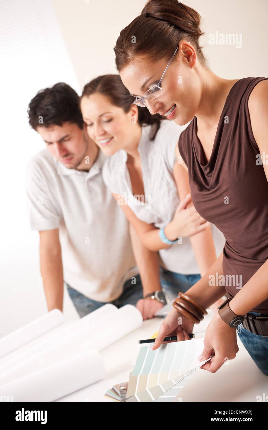 Female interior designer with two clients at office Stock Photo - Alamy