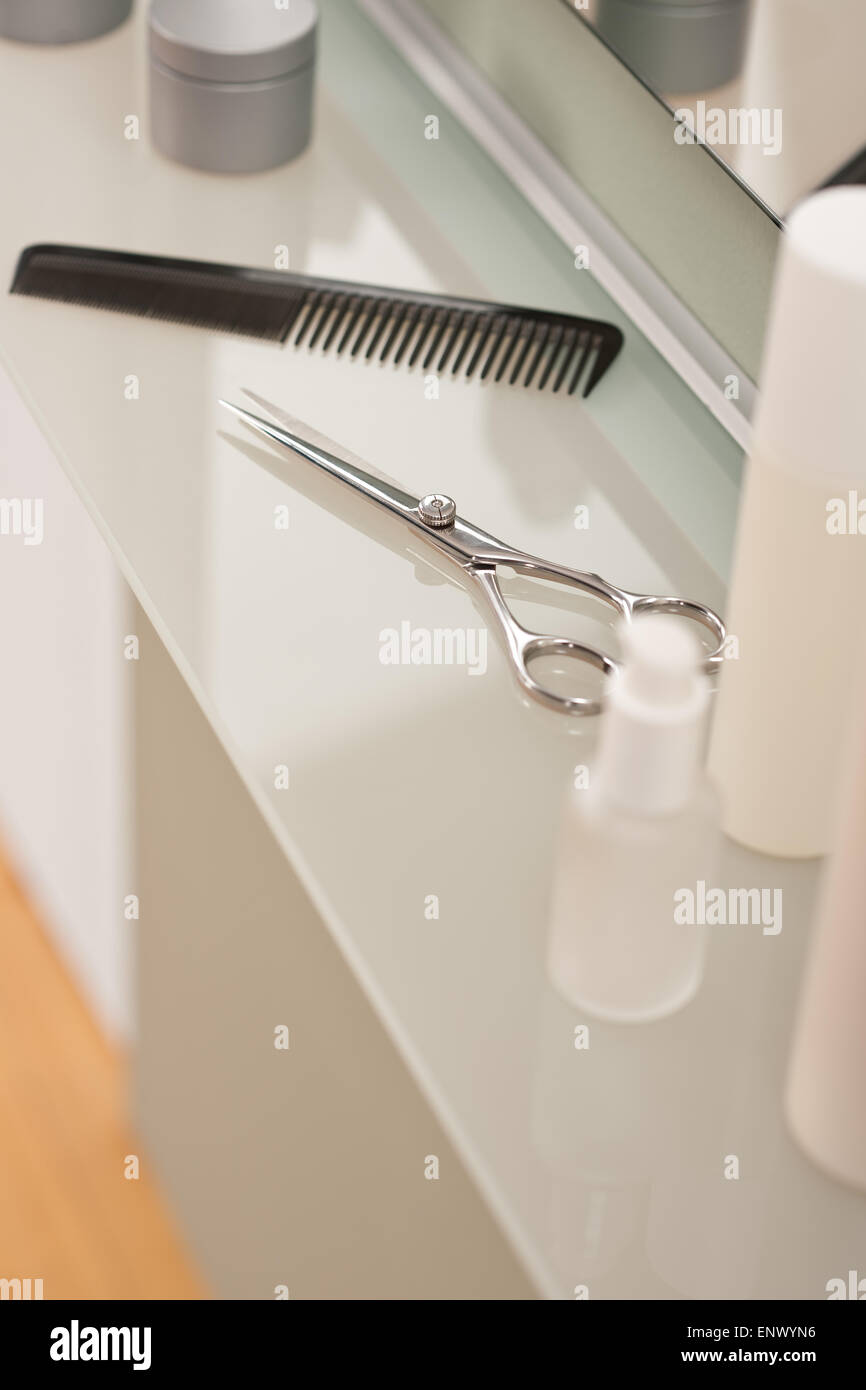 Professional hairdresser salon with comb and scissors Stock Photo