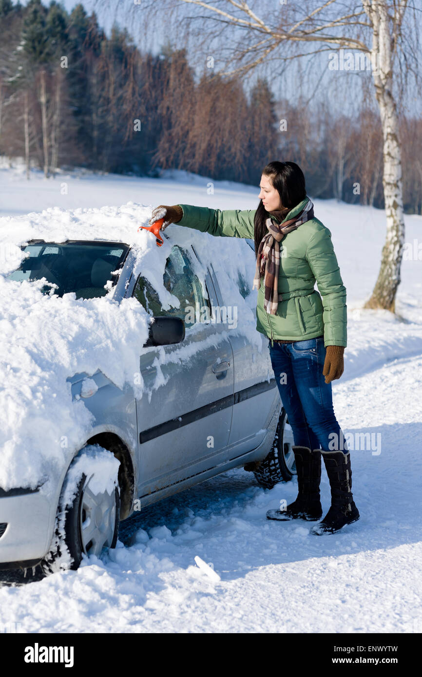 Winter car woman remove snow from windshield Stock Photo Alamy