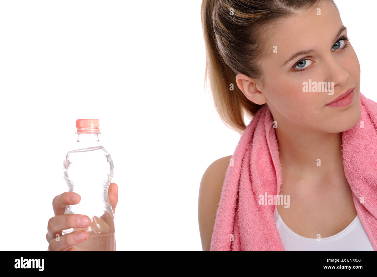 Fitness - Young sportive woman with water and towel Stock Photo - Alamy