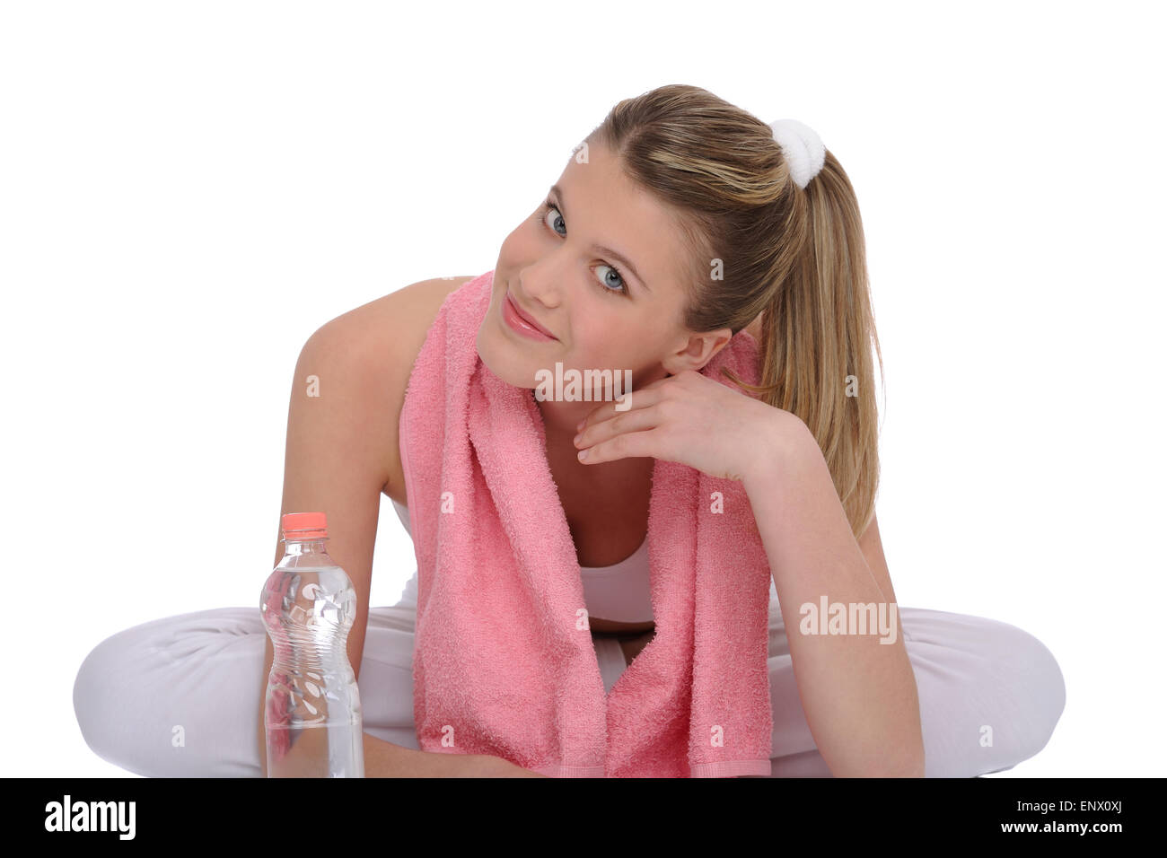 Fitness - Young sportive woman with water and towel Stock Photo - Alamy