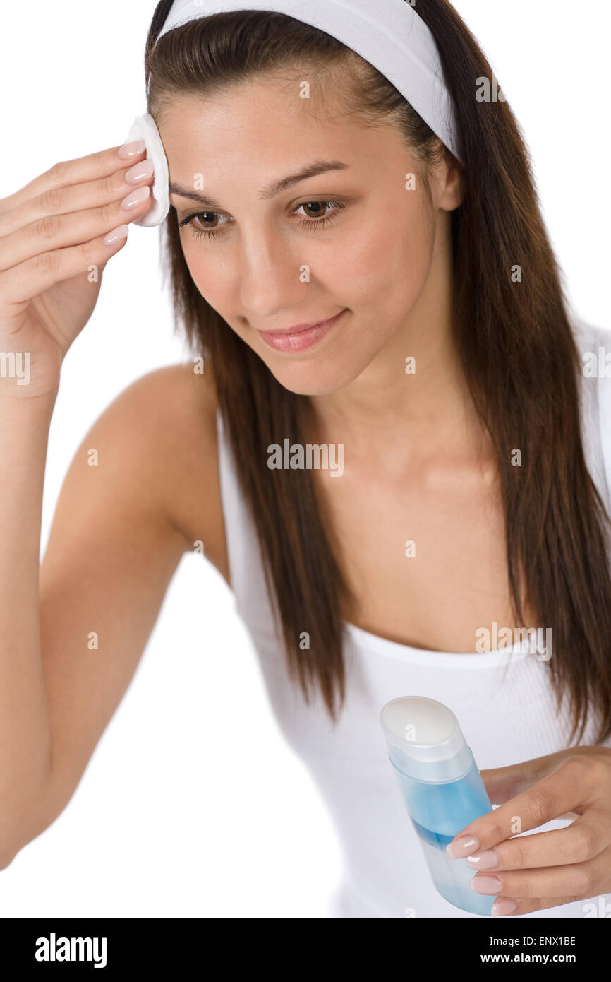 Beauty facial care - Teenager woman cleaning acne skin Stock Photo