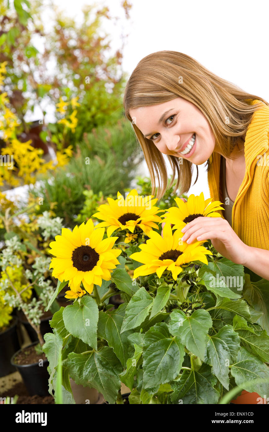 Gardening - portrait of woman with sunflowers Stock Photo