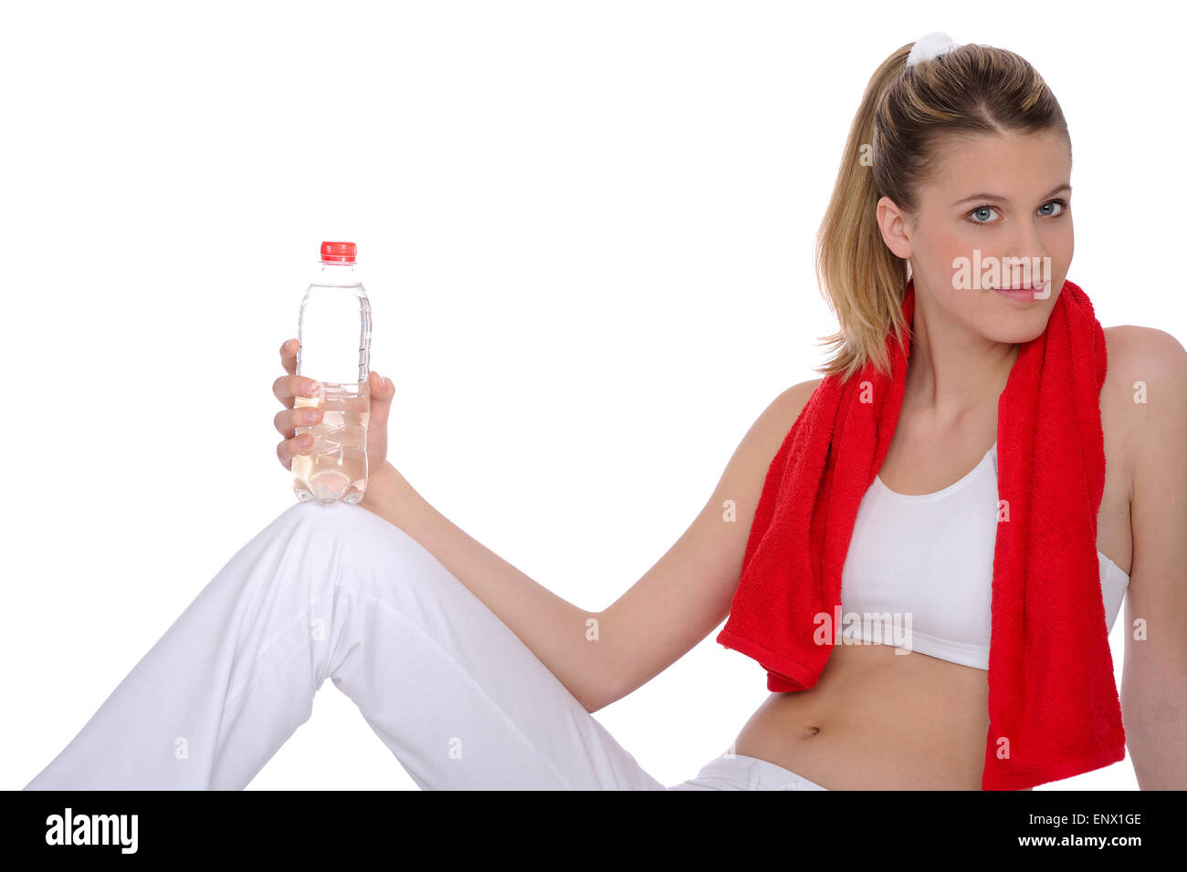 Fitness - Young sportive woman with water and towel Stock Photo - Alamy