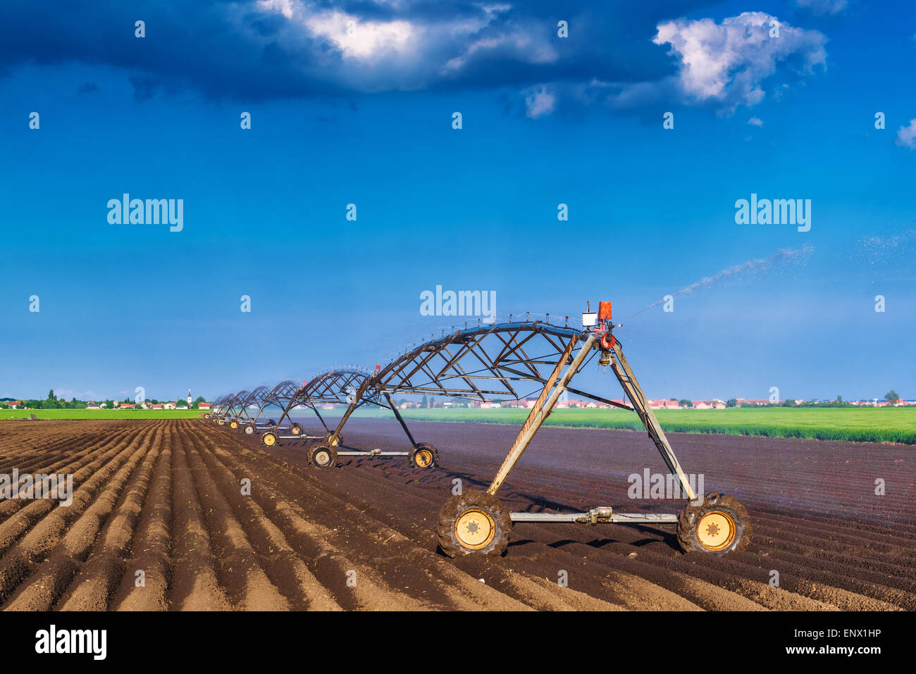 Automated Farming Irrigation Sprinklers System in Operation on ...