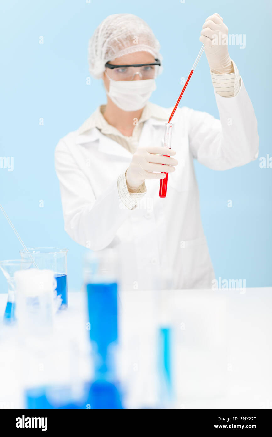 Flu virus vaccination research - woman scientist in laboratory Stock Photo