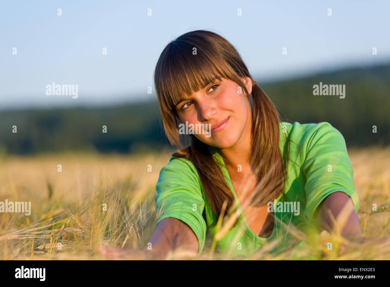 Portrait of happy woman in sunset corn field Stock Photo - Alamy