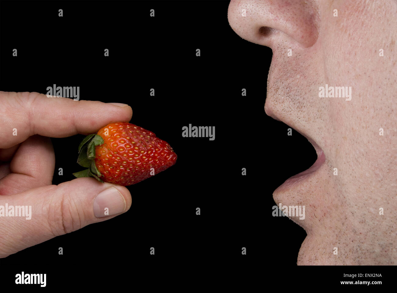 Man eating strawberries hi-res stock photography and images - Alamy