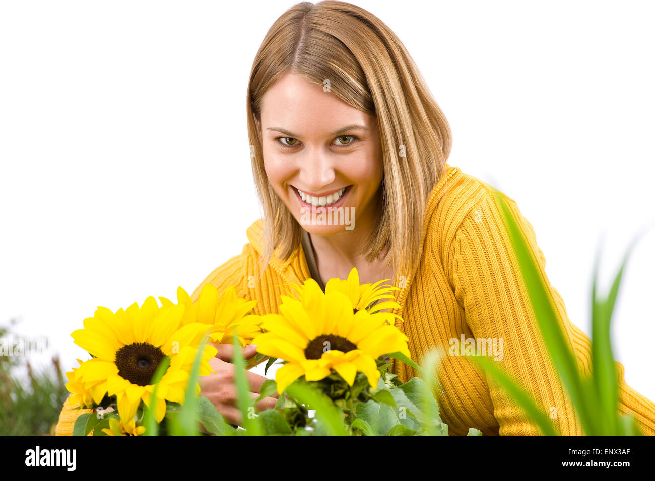 Gardening - portrait of smiling woman with sunflowers Stock Photo
