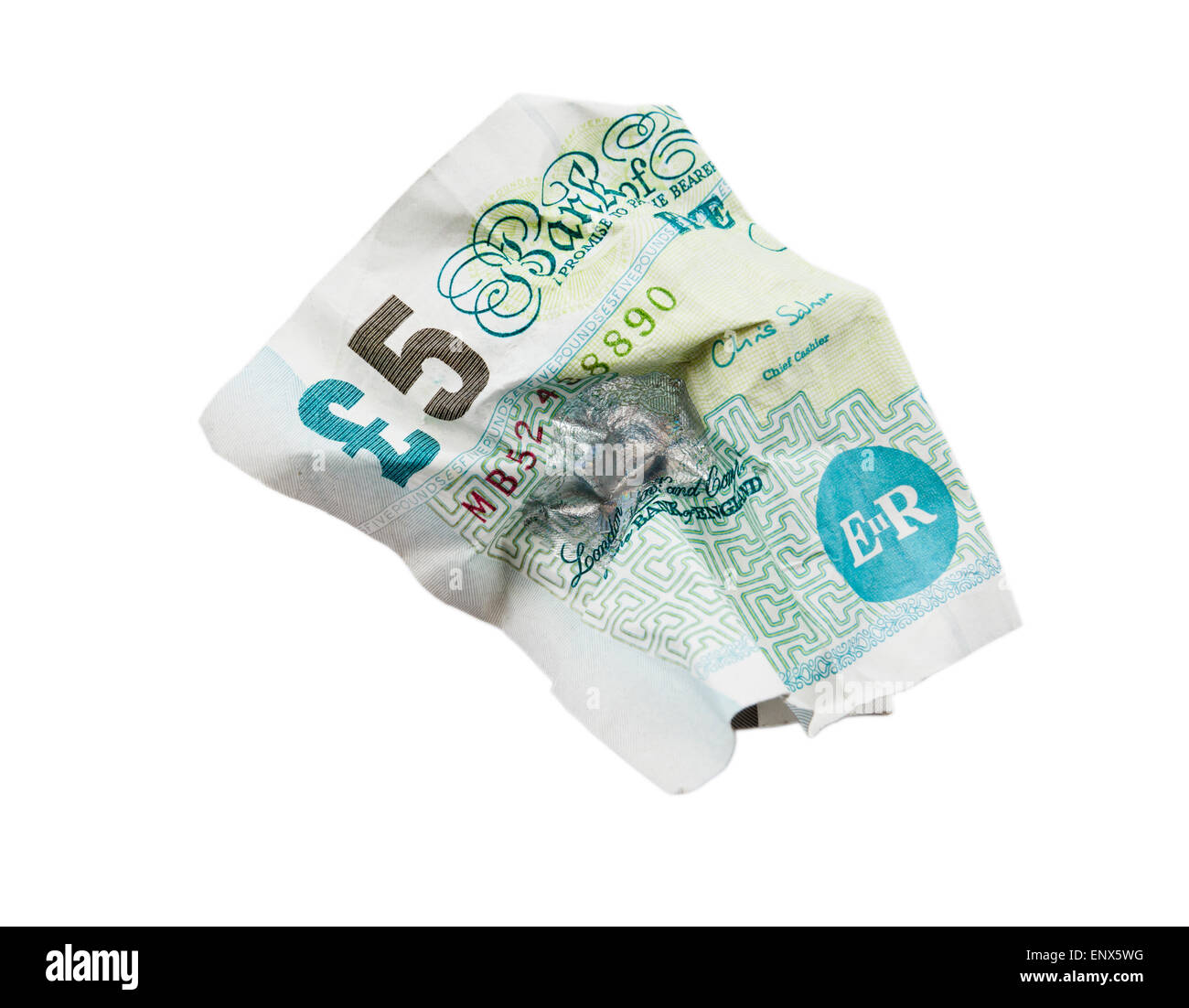 British Sterling old paper five pound note crumpled and screwed up isolated on white. England UK Britain Stock Photo