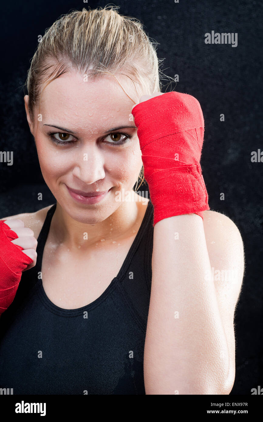 Boxing training blond woman sparring punching bag Stock Photo Alamy