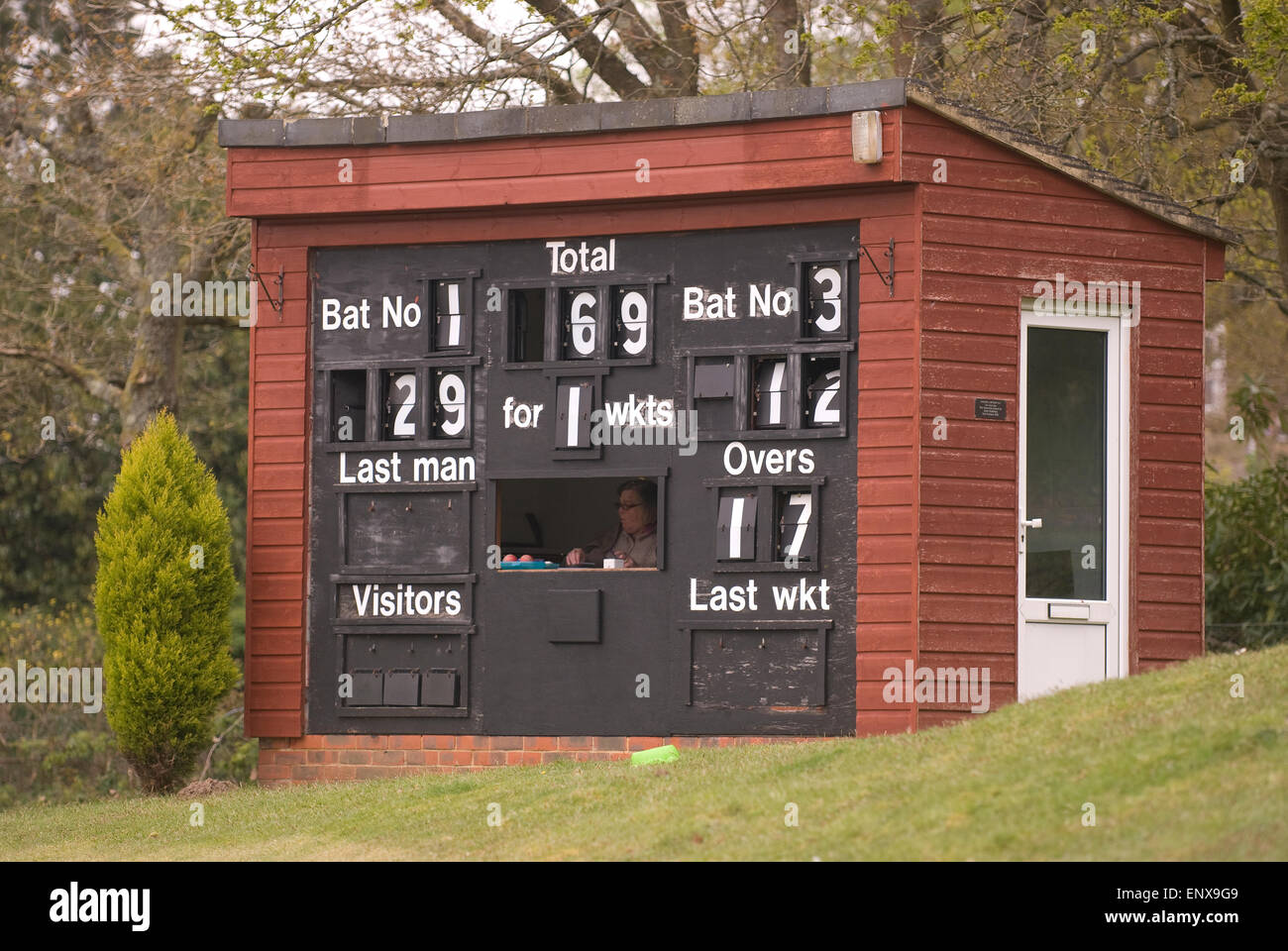 Cricket scorer and board during a local village green match, Liphook, Hampshire, UK. Stock Photo